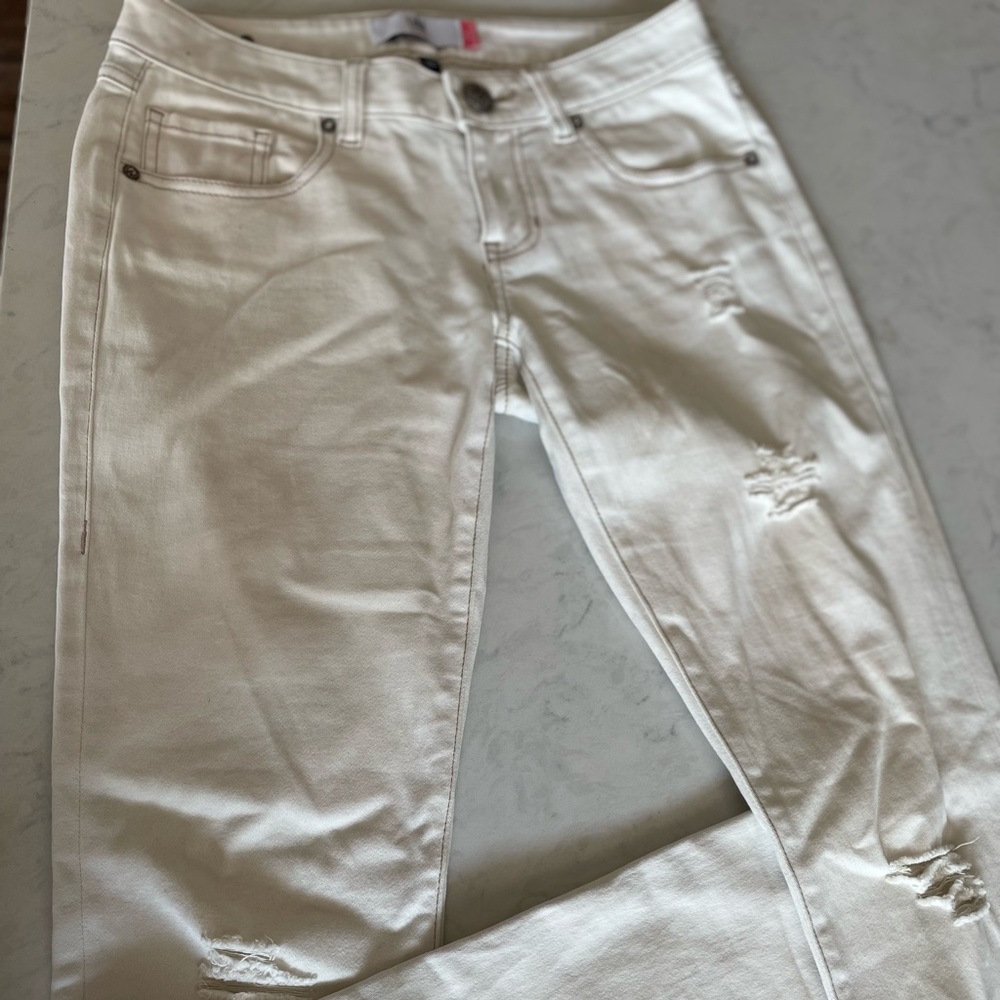 CAbi slim boyfriend jeans.  Distressed, size 0.